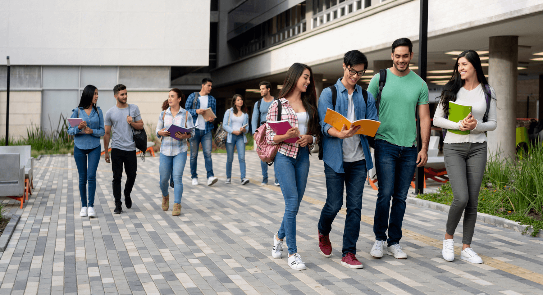 Group of students walking on campus.