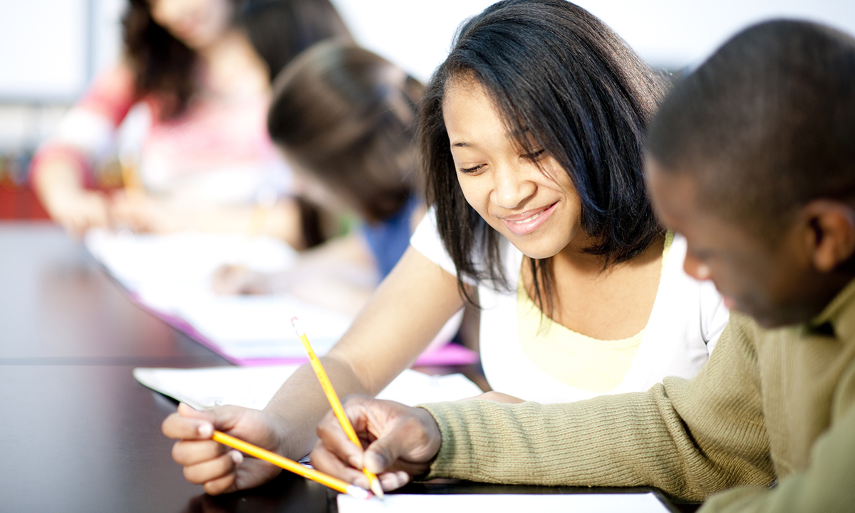 College students working together on a class assignment