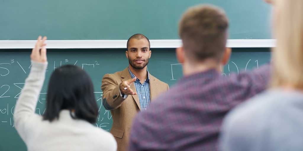 Teacher calling on students in class