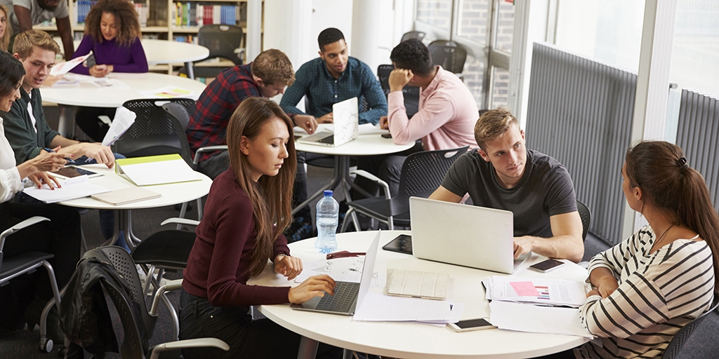 College students working together at the library