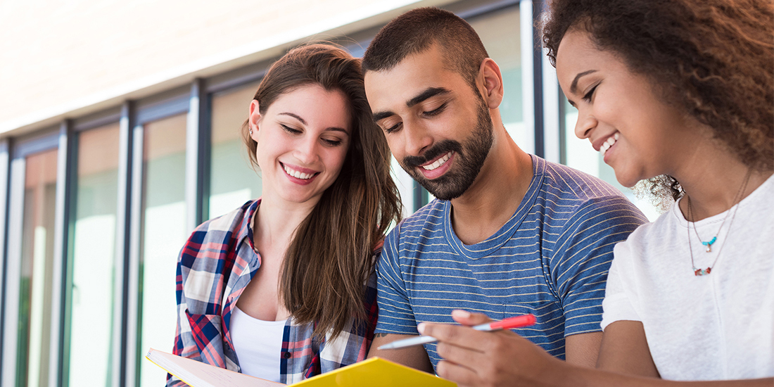 Three students study together