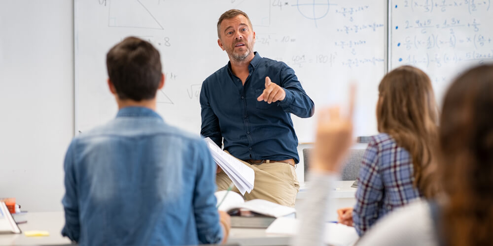 Math professor in front of college class