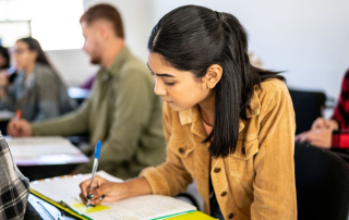Young woman studying in the classroom at university