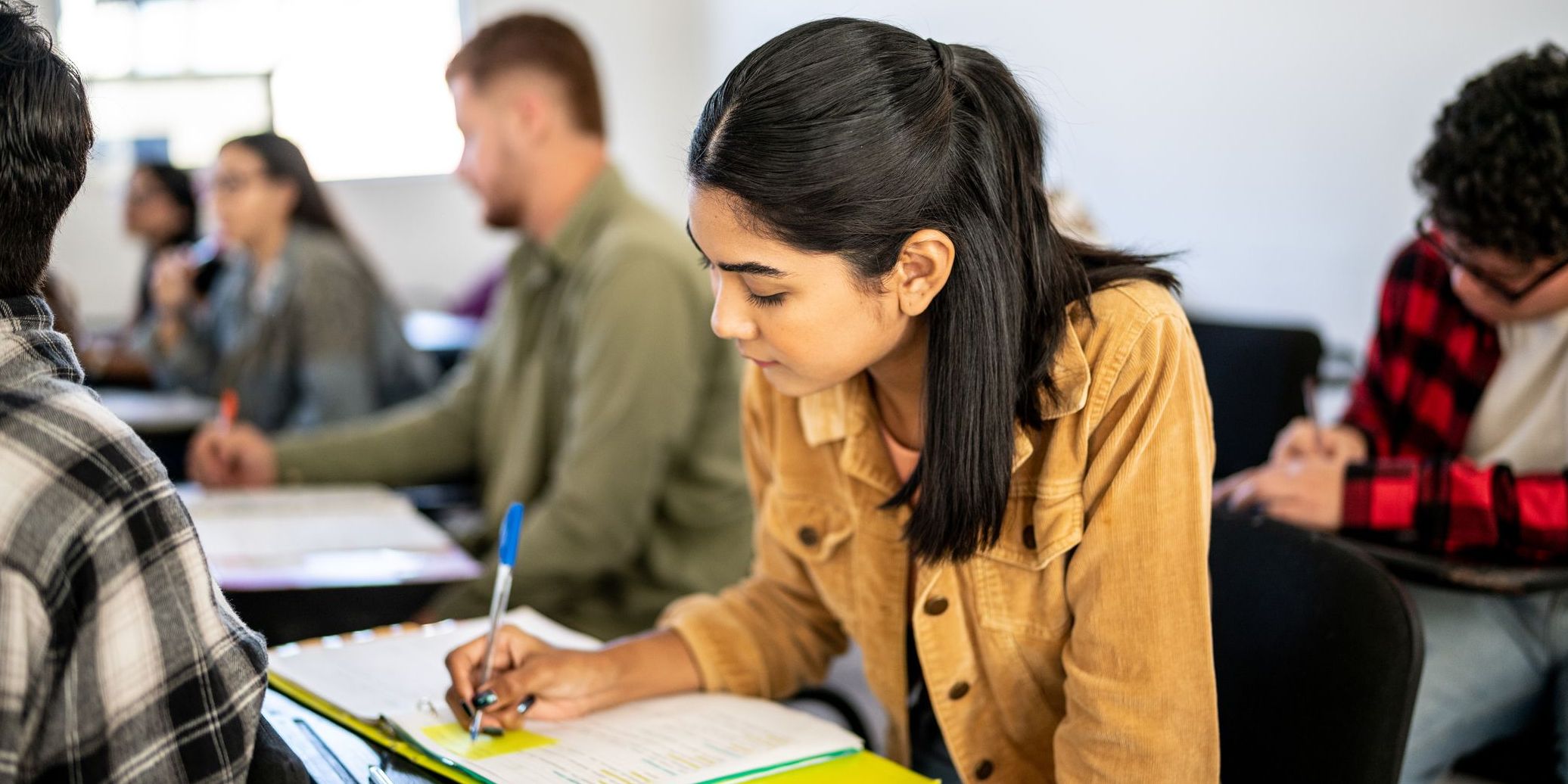 Young woman studying in the classroom at university